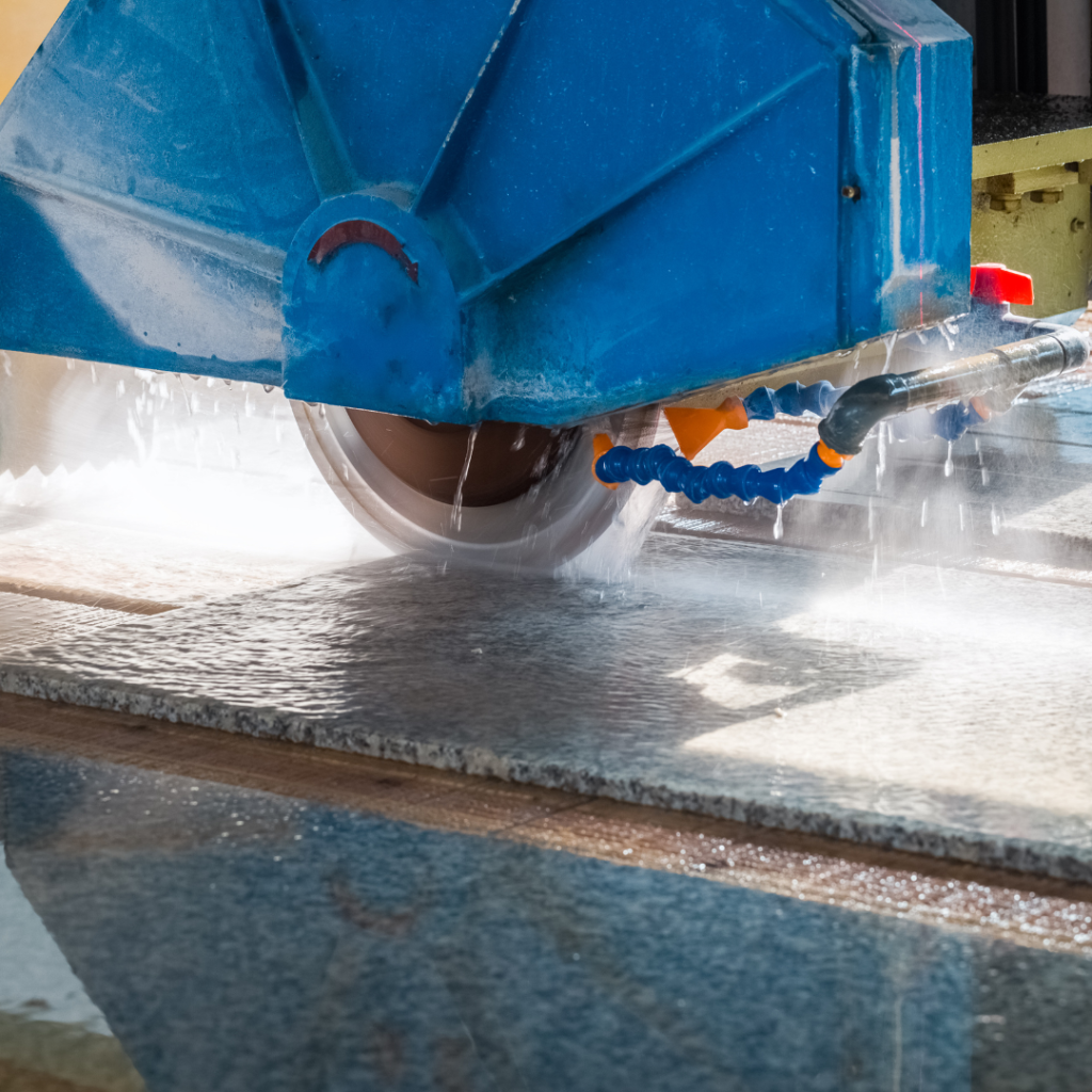 machine cutting a granite countertop being used in the workshop